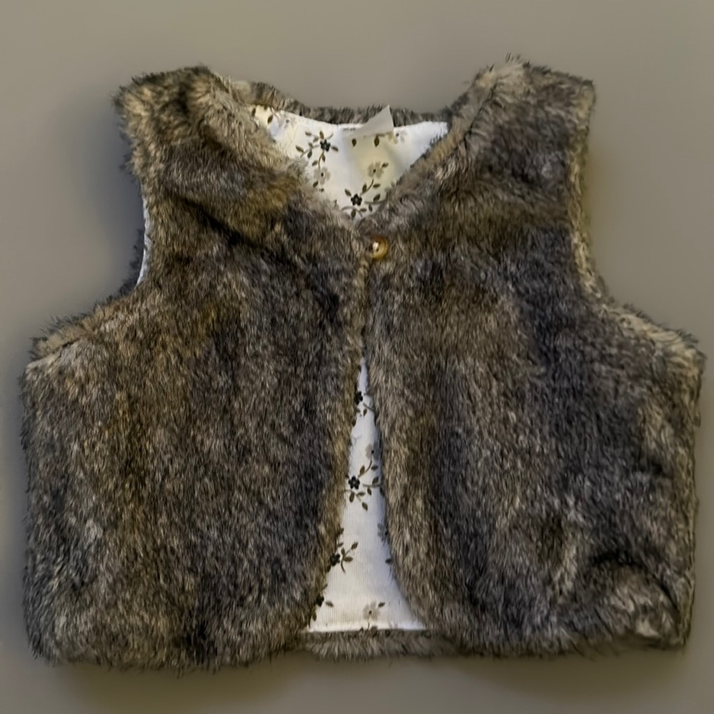 Adorable baby girl size 6 months Carter’s fur vest